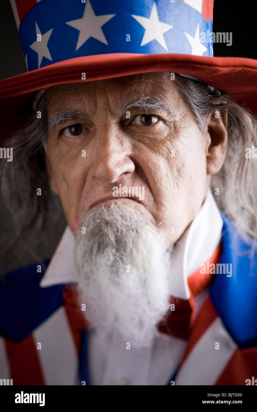 Portrait of man in Uncle Sam's costume, studio shot Stock Photo