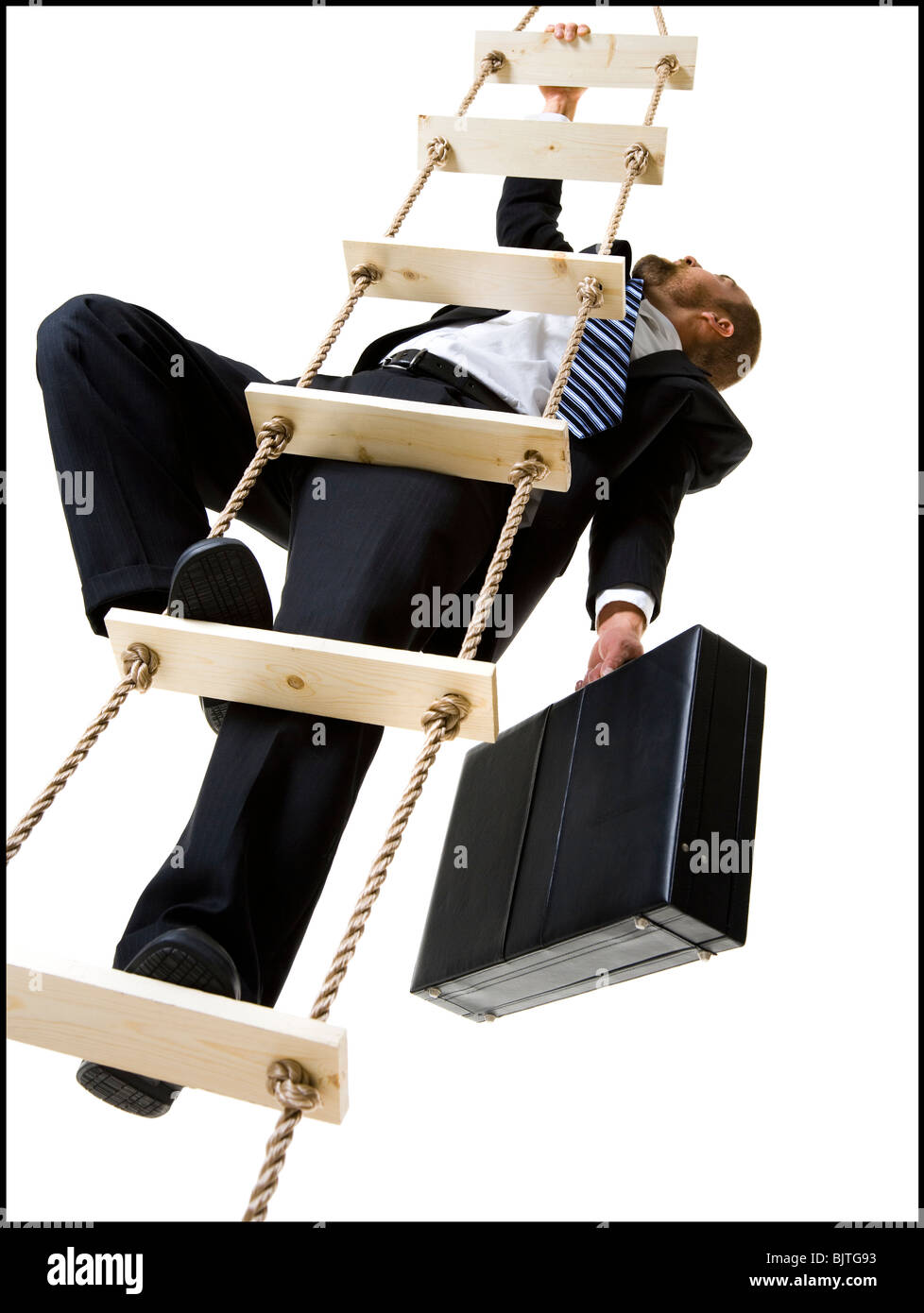 Businessman climbing a ladder with briefcase Stock Photo Alamy