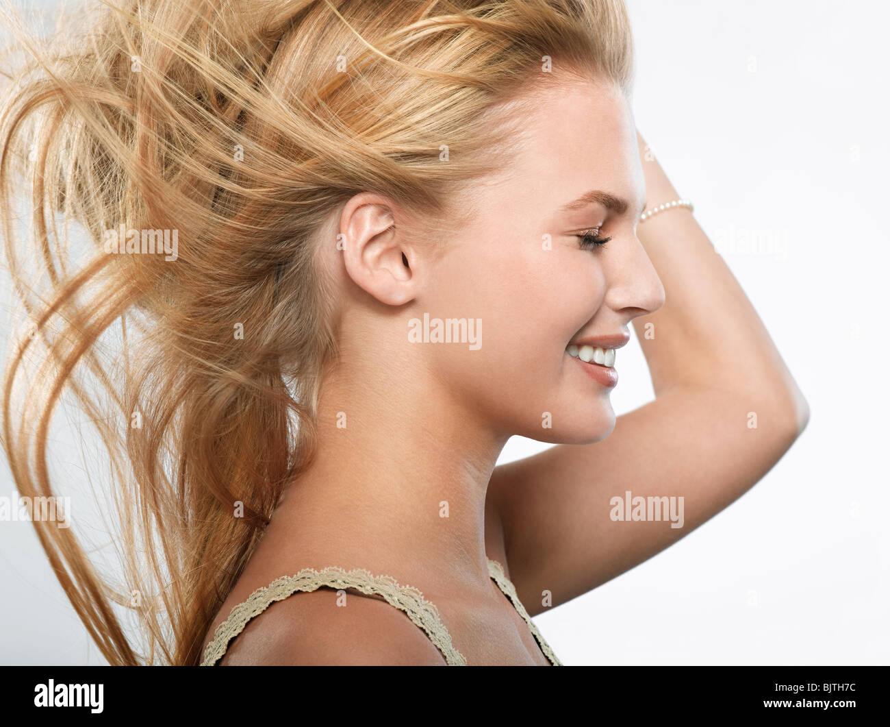 Blonde woman in white vest top hi-res stock photography and images - Alamy
