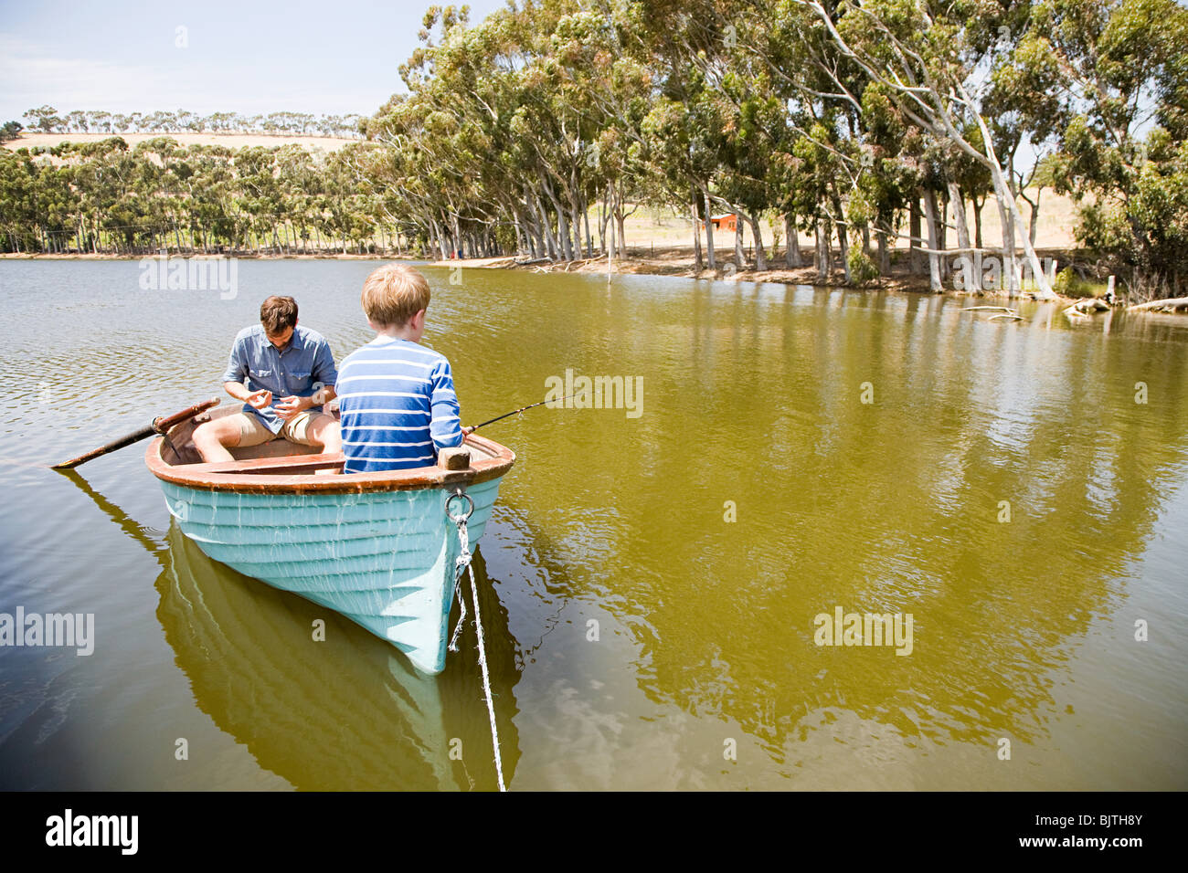 Family with rowing boat Stock Photo