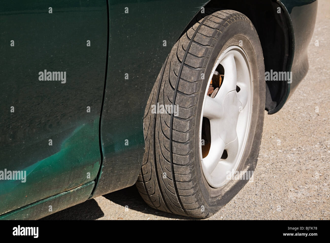 Car with flat tire Stock Photo Alamy
