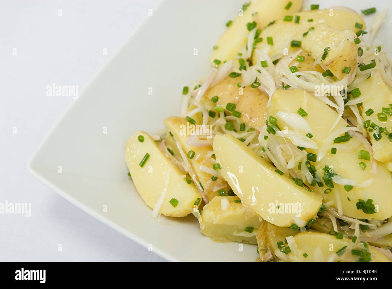 Potatoes with onions and chives Stock Photo