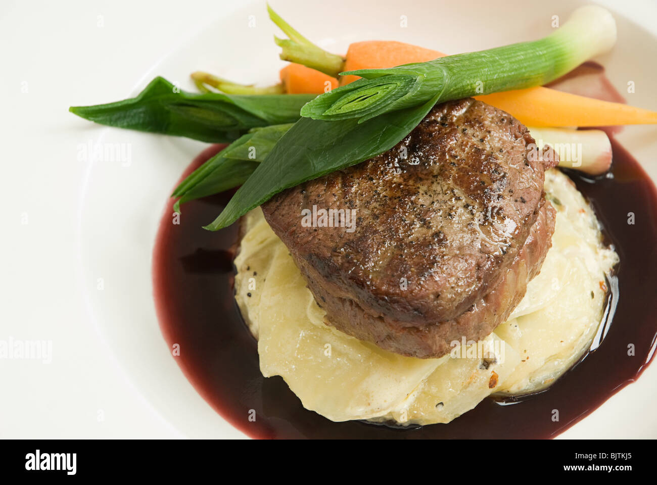 Beef with dauphinoise potatoes and vegetables Stock Photo Alamy