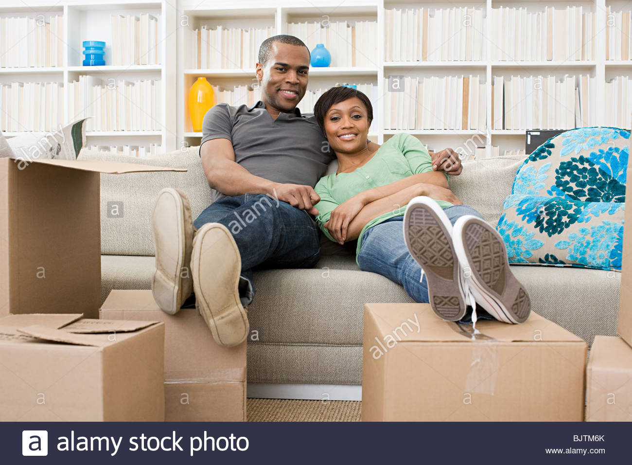 A Woman With Feet On A Sofa Stock Photos & A Woman With Feet On A Sofa