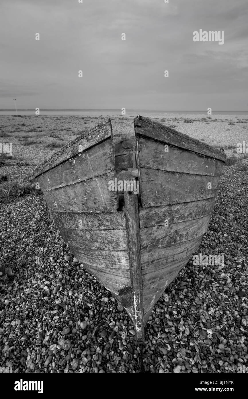An abandoned fishing boat on the shingle at Dungeness, Kent Stock Photo ...