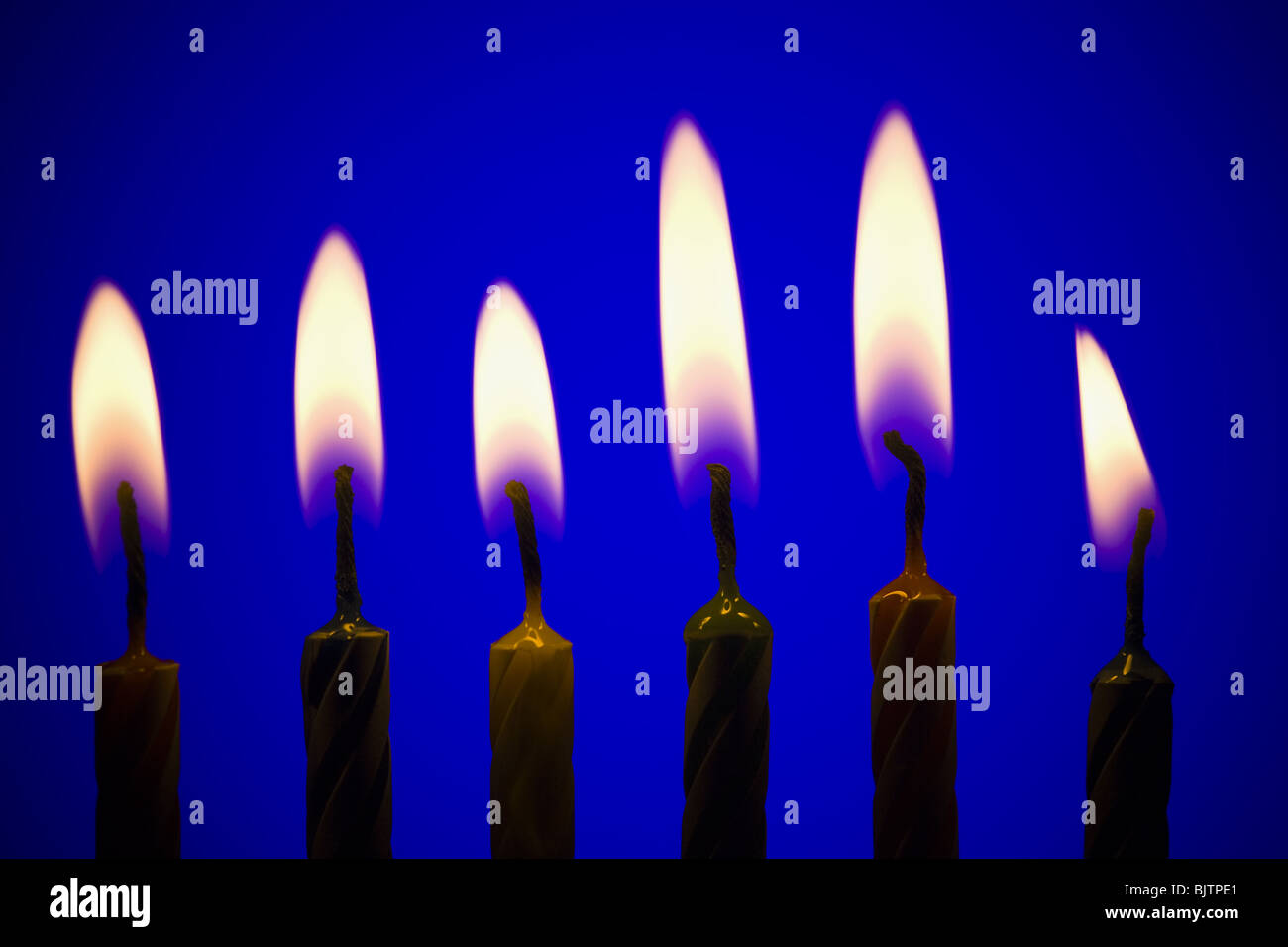 Six burning birthday candles Stock Photo Alamy