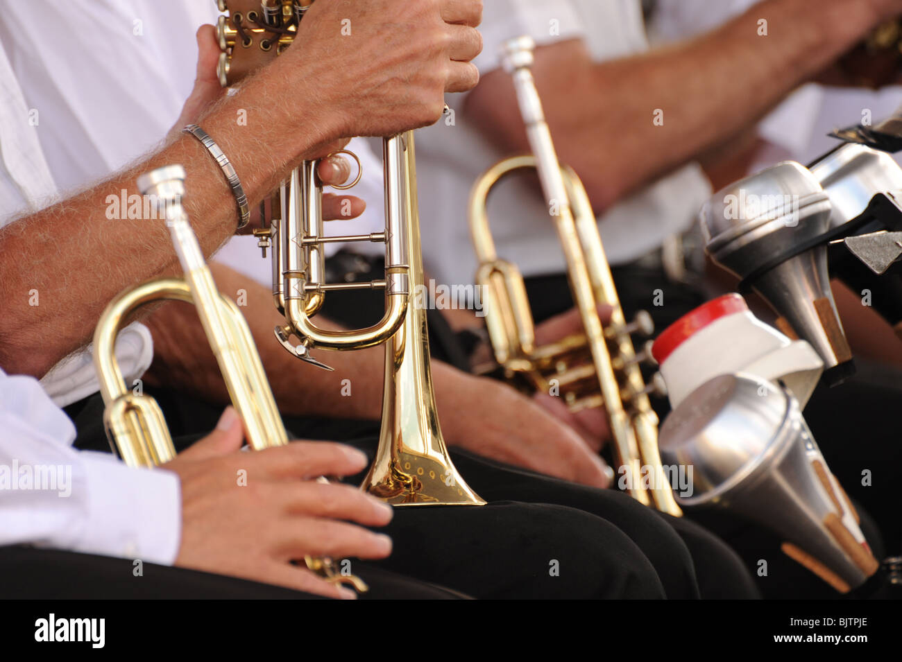 Photograph of trumpets being held by people shot does not include their heads Stock Photo