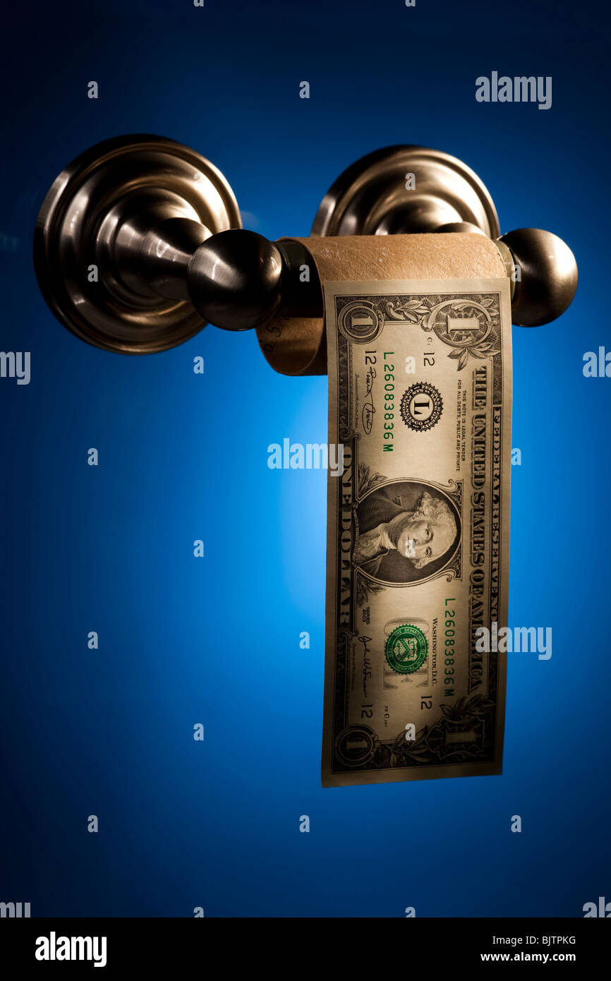 Toilet paper roll with one dollar bill Stock Photo