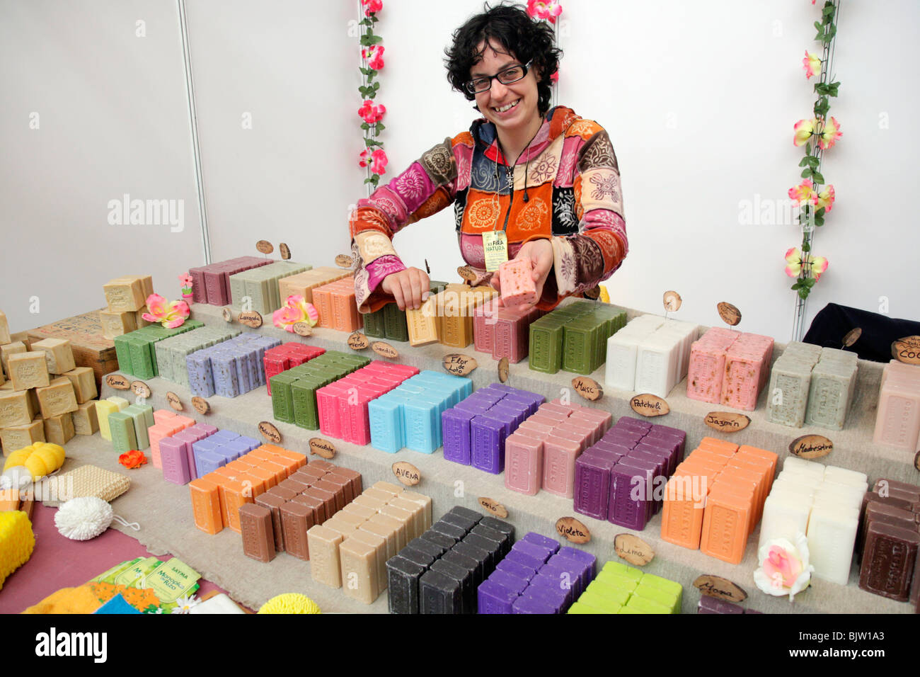 Natural soaps. Saleswoman in a stall. Fira Natura. Lleida. Catalonia, Spain. Stock Photo