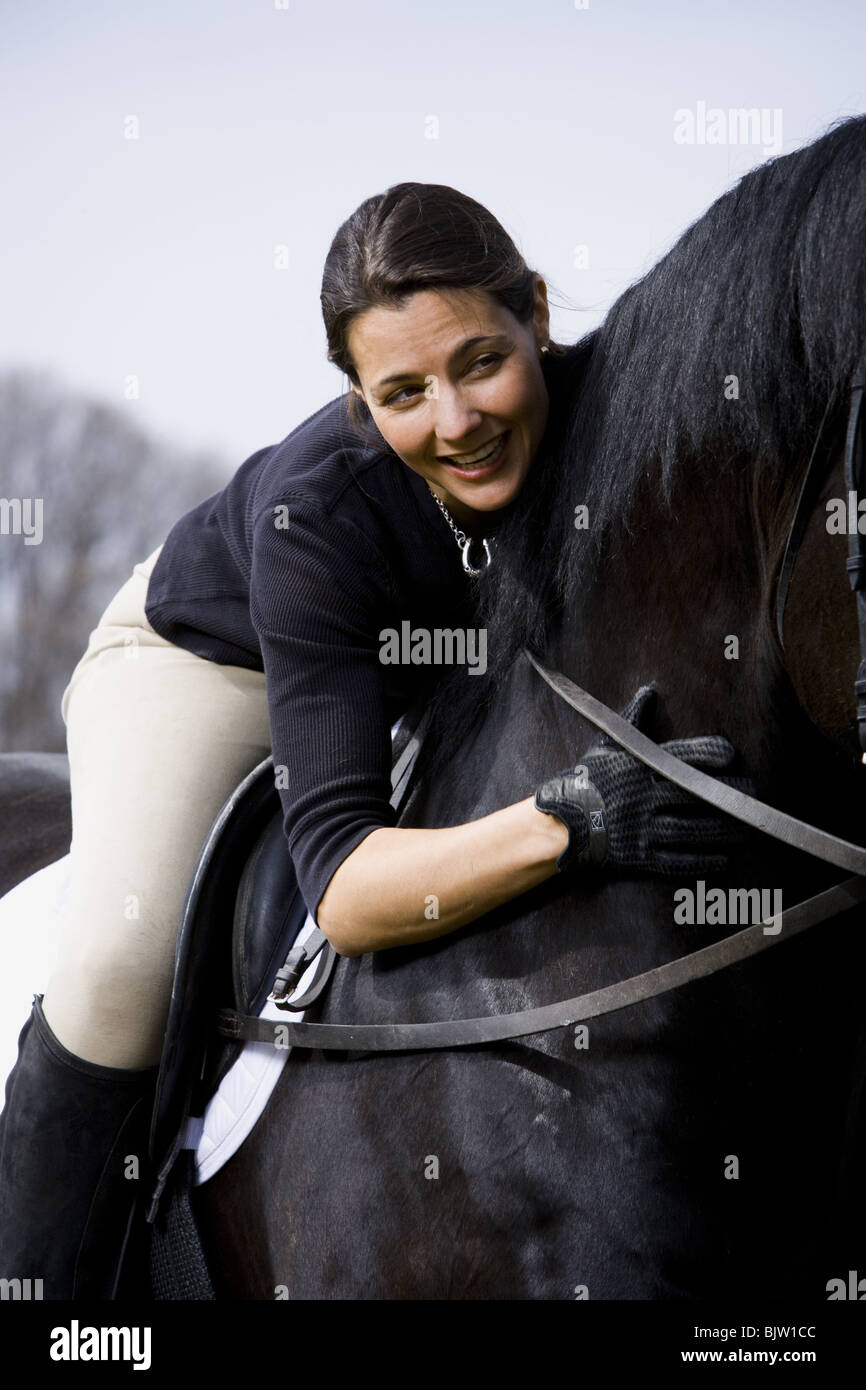 Woman on horseback Stock Photo