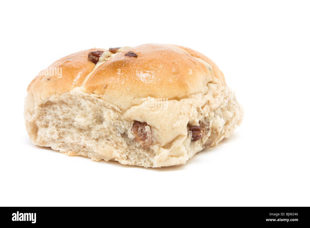 Sticky Hot Cross Bun isolated against white background. Stock Photo