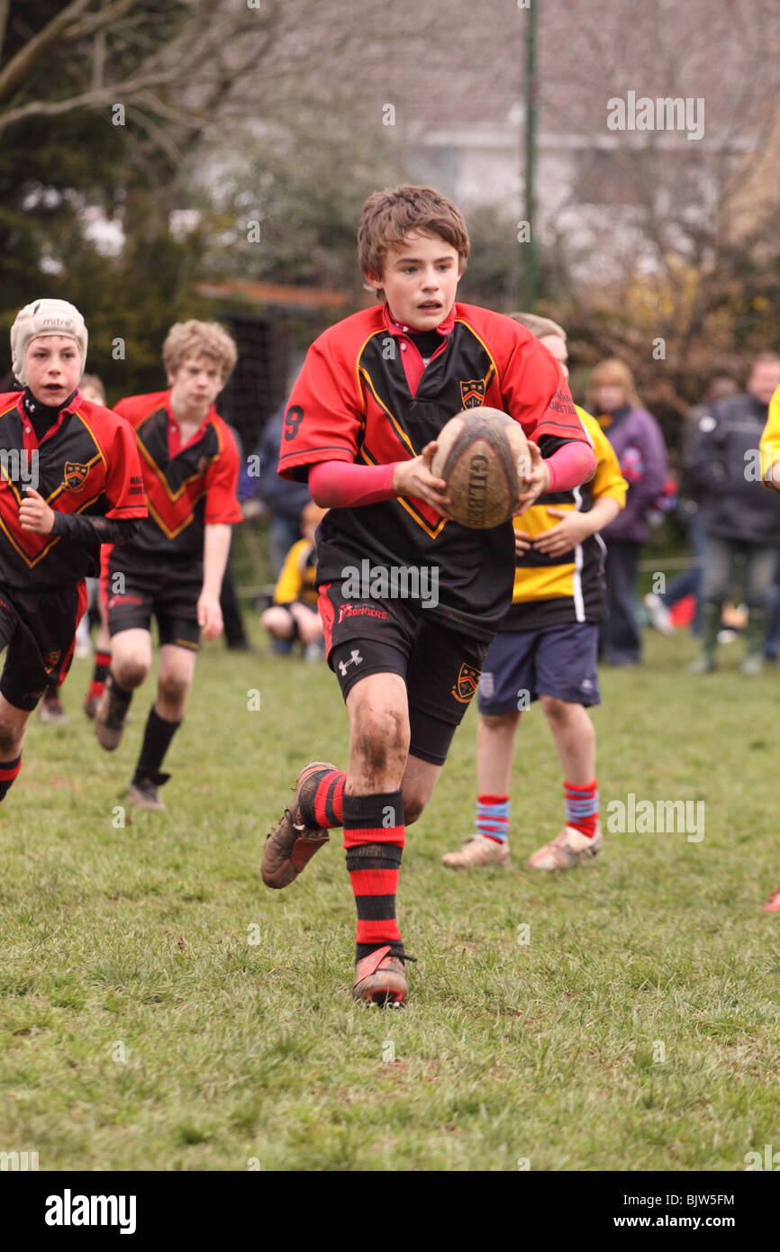 Junior rugby young players in club competition match running with the ball EDITORIAL USE ONLY