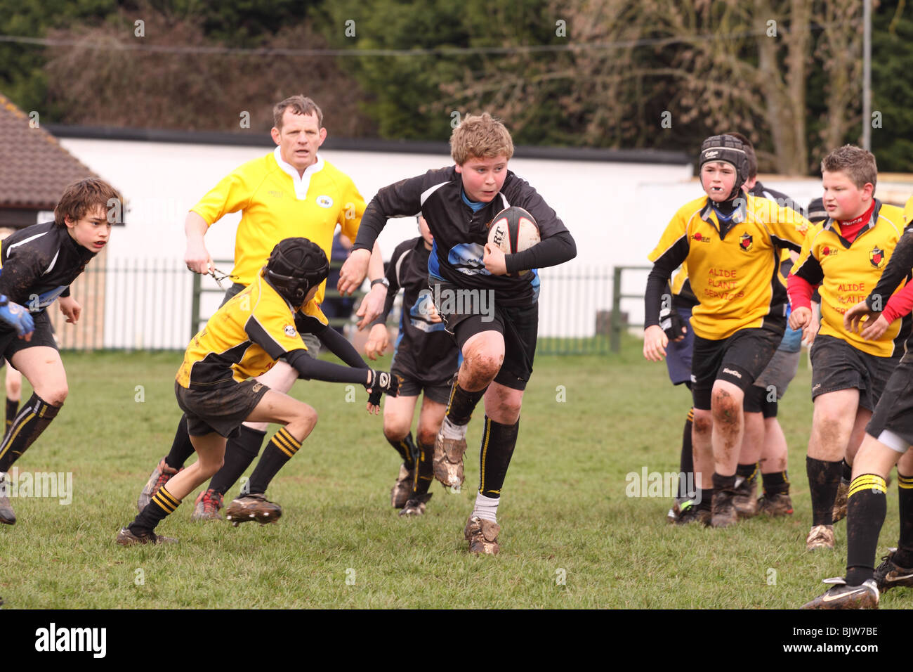 Junior rugby young players in club competition match running with the ball being tackled EDITORIAL USE ONLY Stock Photo