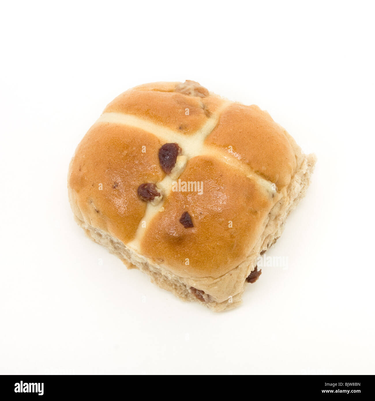Sticky Hot Cross Bun isolated against white background. Stock Photo