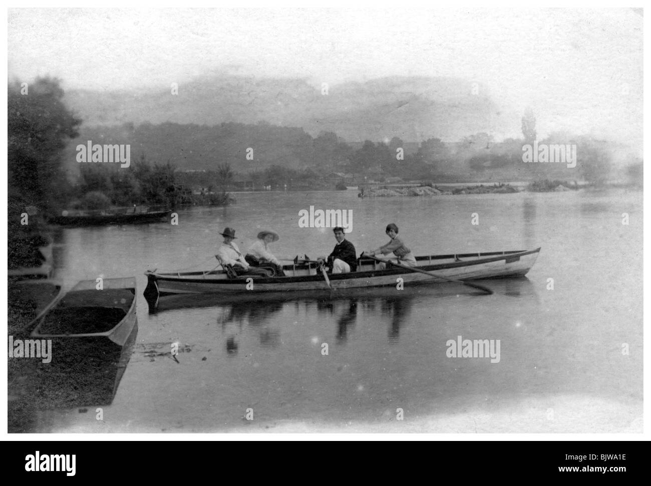 Lady rowing a boat Black and White Stock Photos & Images - Alamy