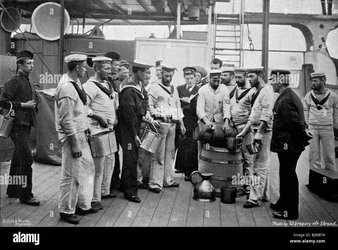Issuing rum on board HMS 'Royal Sovereign', 1896. Artist: W Gregory Stock Photo