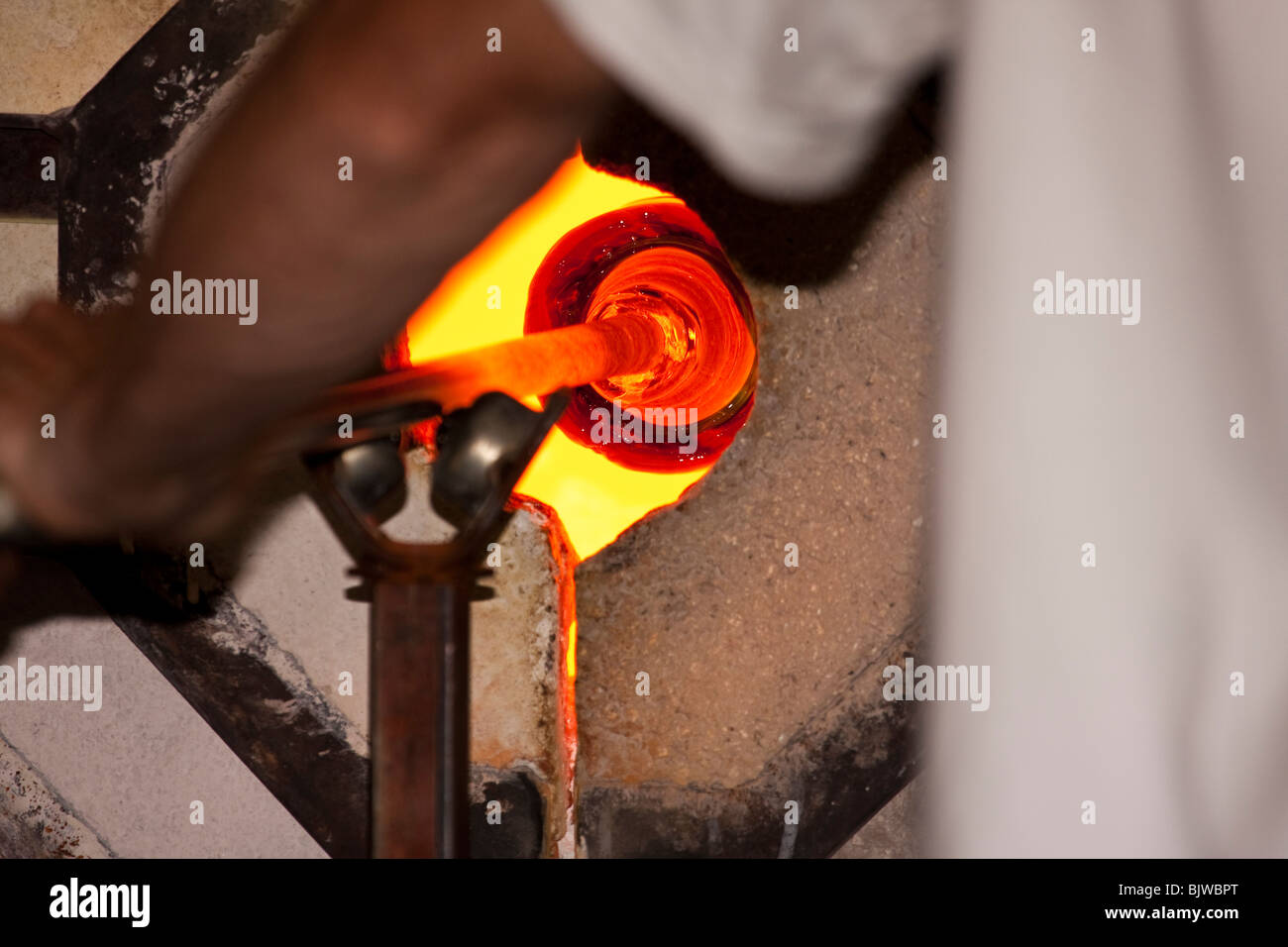 Glassblower molding glass Stock Photo Alamy