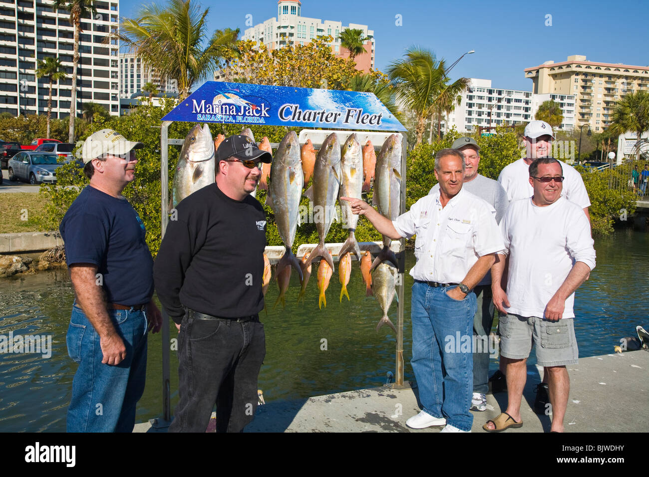 Fishermen with their catch of fish from the Gulf of Mexico at marina in