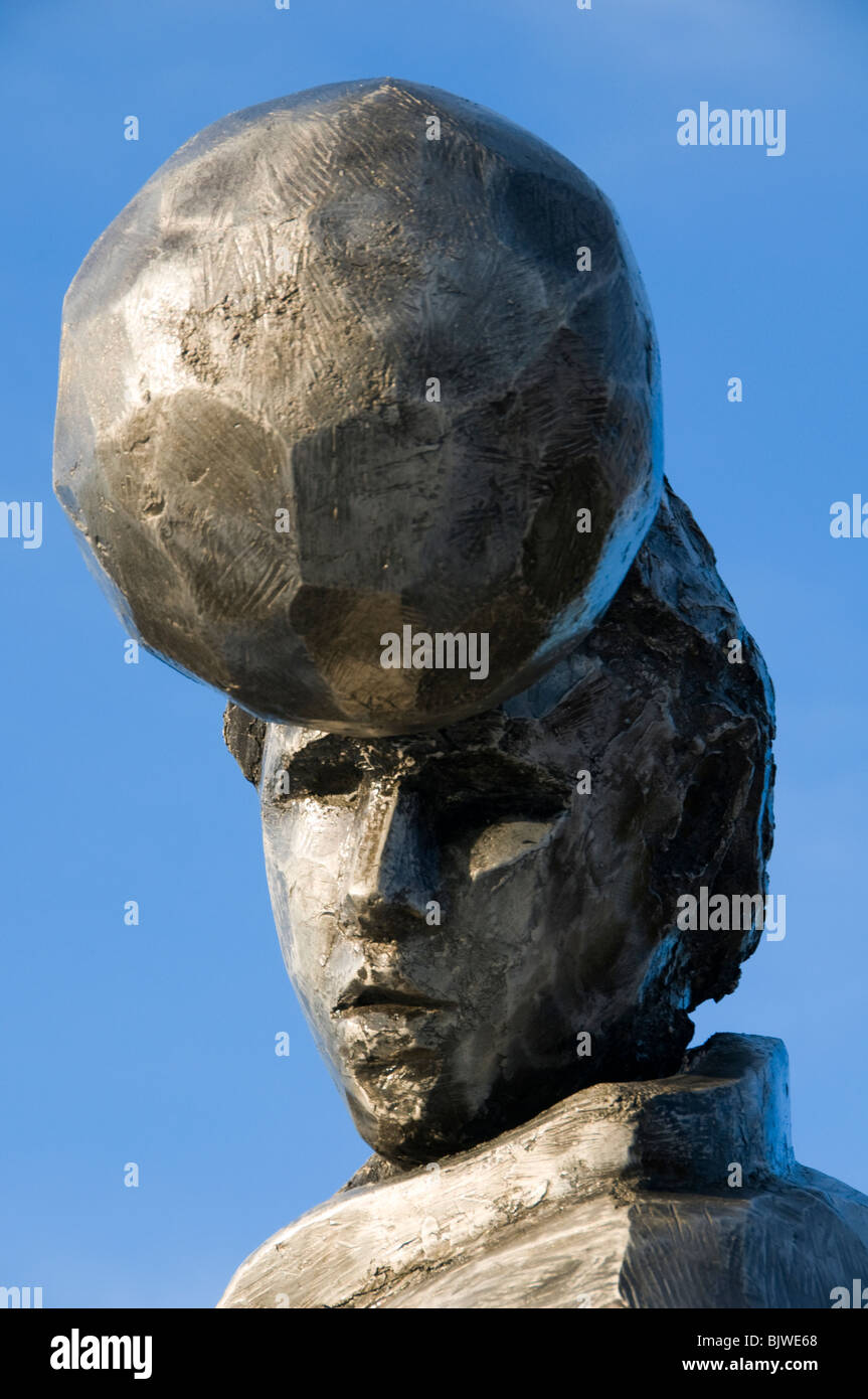 Sculpture depicting a man heading a football, Lord Sheldon Way, Ashton under Lyne, Tameside