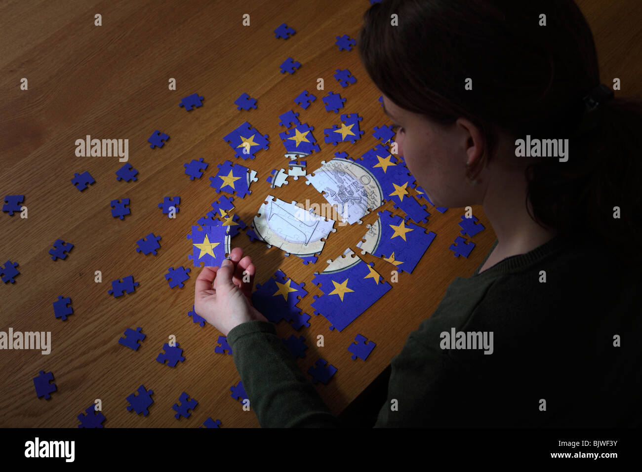 Puzzle with the emblem of the European Union and with Euro coin in the centre Stock Photo