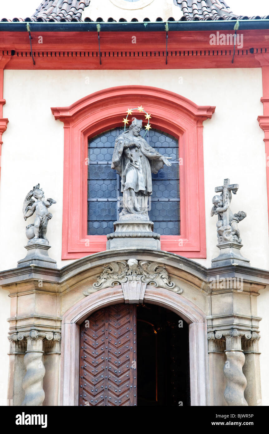 PRAGUE, Czech Republic - Basilica of St George in Prague Castle. The iconic Prague Castle, a symbol of Czech history and power, stands majestically on a hill overlooking the city. It is the largest ancient castle in the world and a UNESCO World Heritage site, drawing countless visitors each year to explore its captivating history and architectural diversity. Stock Photo