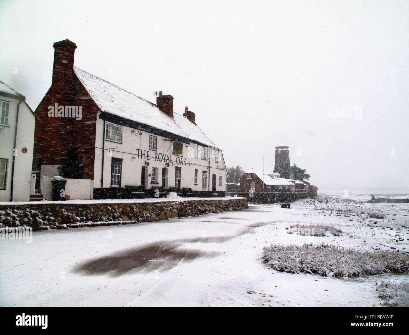 The Royal Oak and Mill, Langstone in the snow Stock Photo