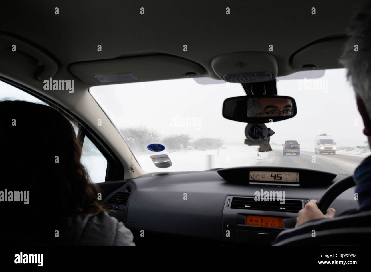 Treacherous driving conditions on the A303 as heavy snow and icey conditions hit Great Britain. Motorway driving in snow. Stock Photo