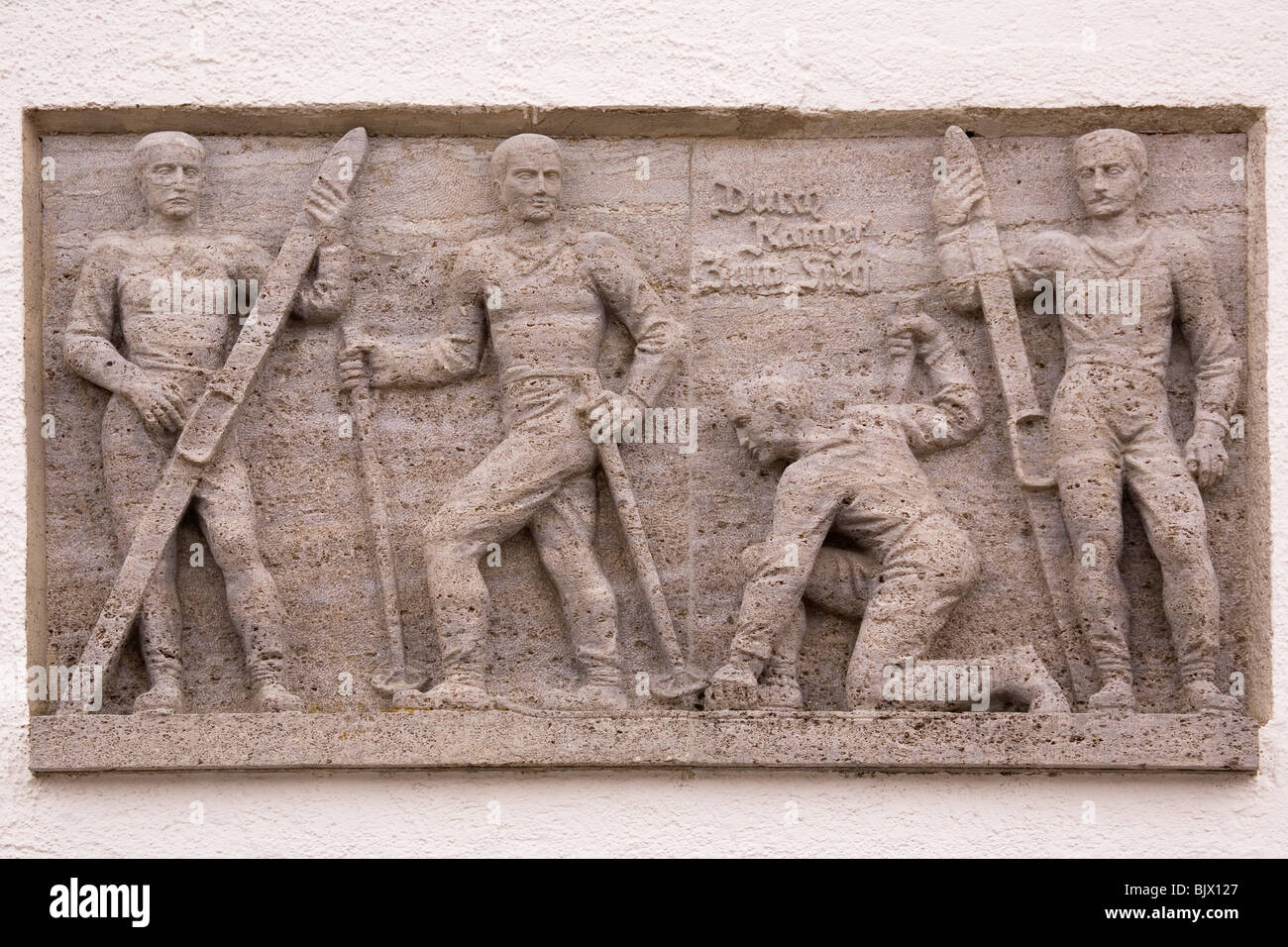 A bas-relief scene showing skiers, on the Olympiahaus in Garmisch-Partenkirchen, Germany. Stock Photo