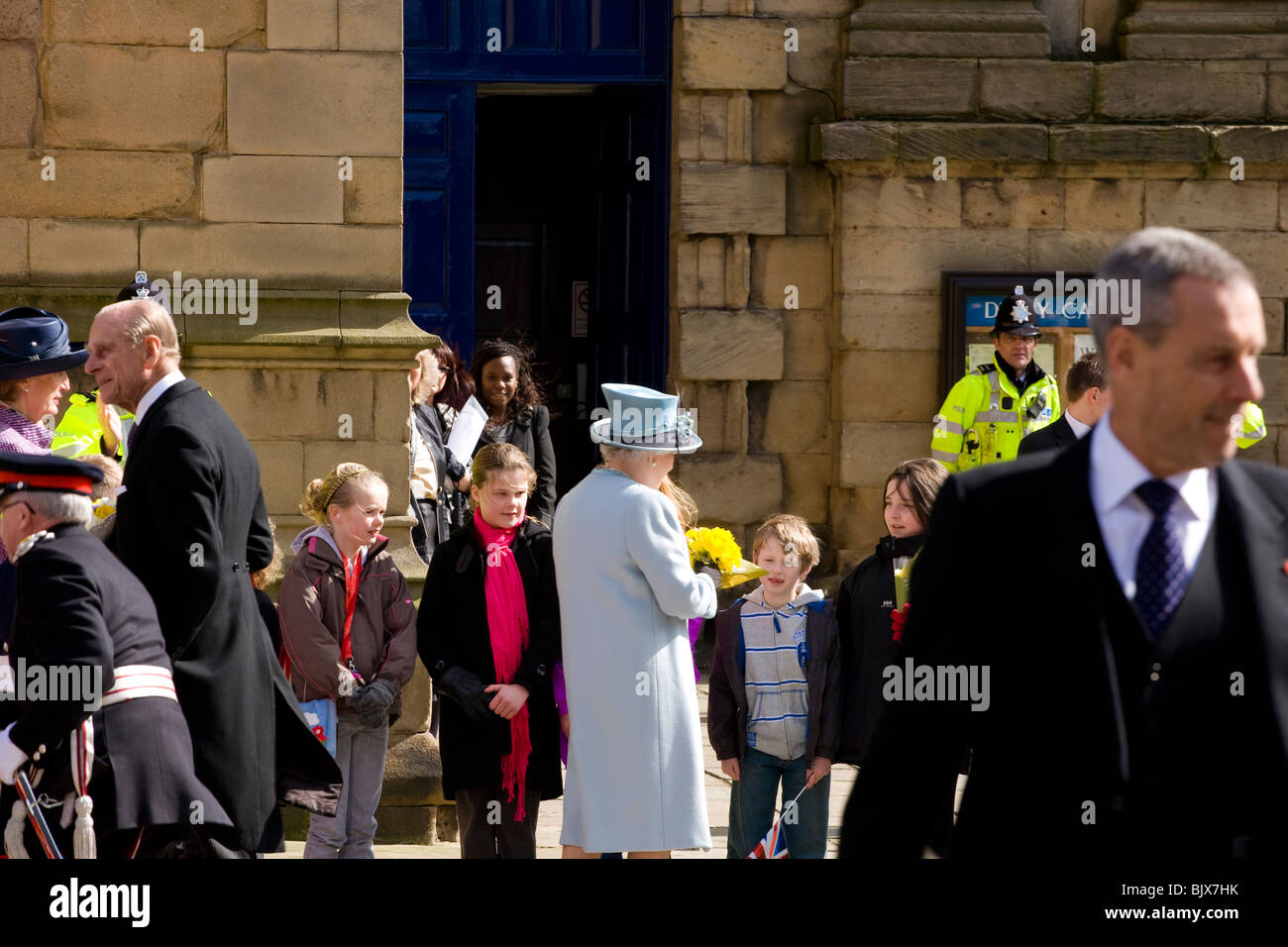 A group of young children line up outside Derby Cathedral to meet the Queen after the Maundy Money ceremony at Easter. Stock Photo