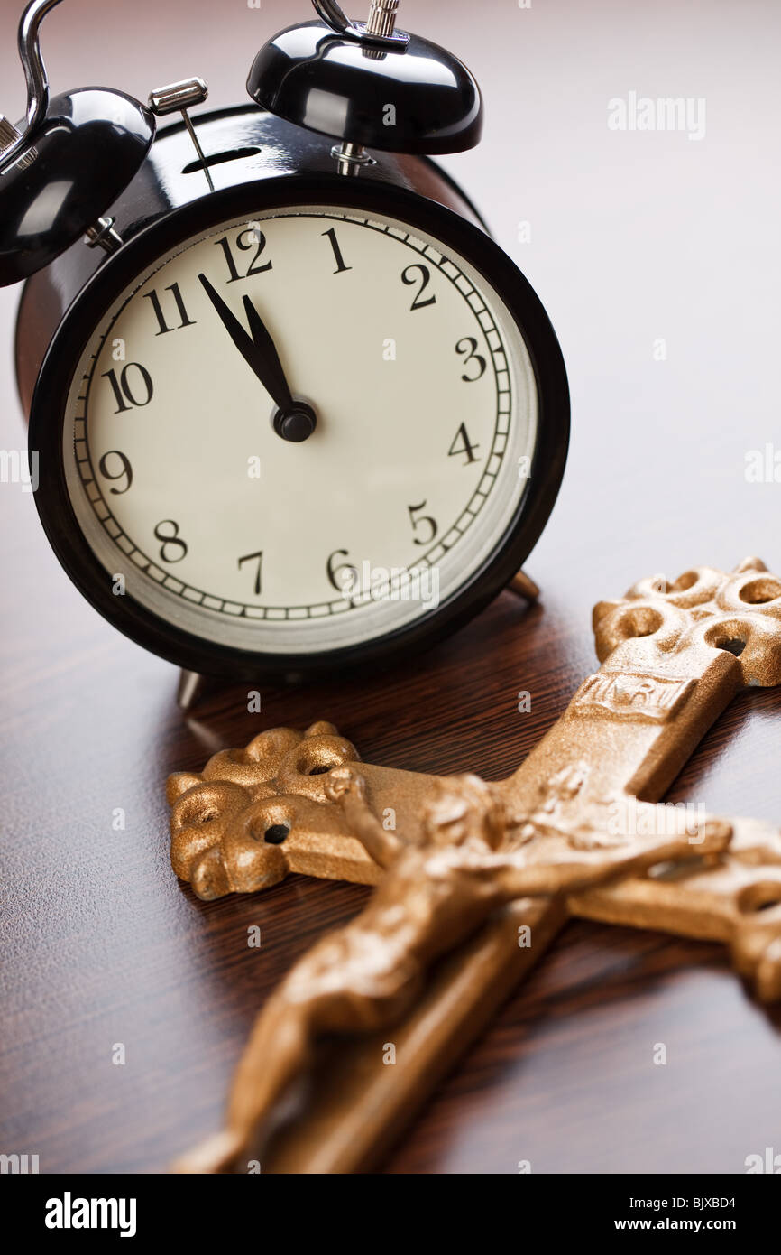 the alarm clock and Jesus crucified on the cross Stock Photo Alamy