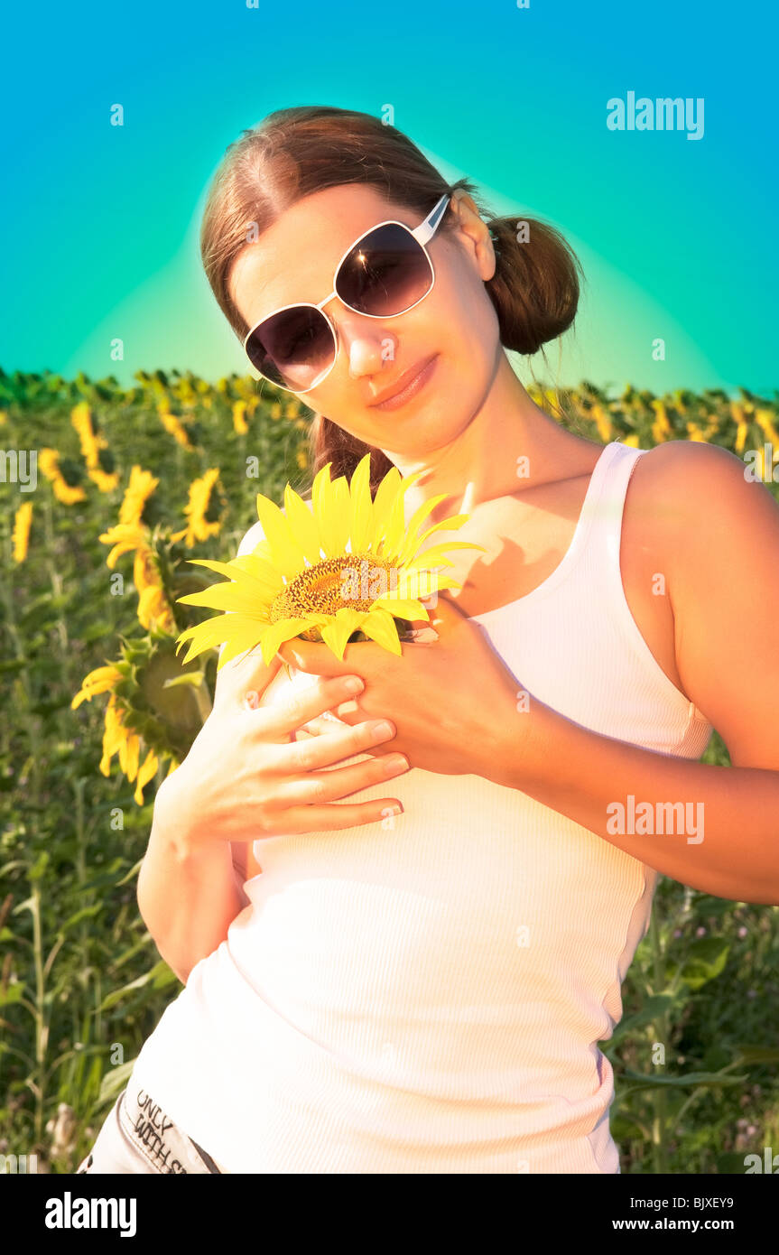 girl with a sunflower Stock Photo - Alamy
