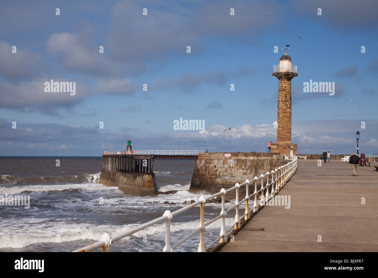 Whitby is a fishing village and tourist town in north east Yorkshire. The harbour and mouth of the River Esk Stock Photo