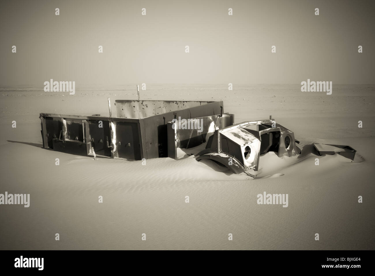 Monochrome image of abandoned Ford 30 CWT CMP truck from 1941/42 era sinking in the sand of the Western Desert, Egypt Stock Photo