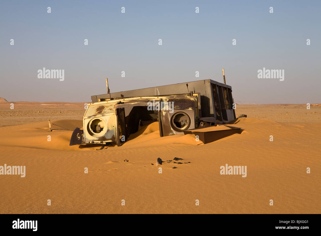 Abandoned Ford 30 CWT CMP truck from 1941/42 era sinking in the sand of the Western Desert, Egypt Stock Photo