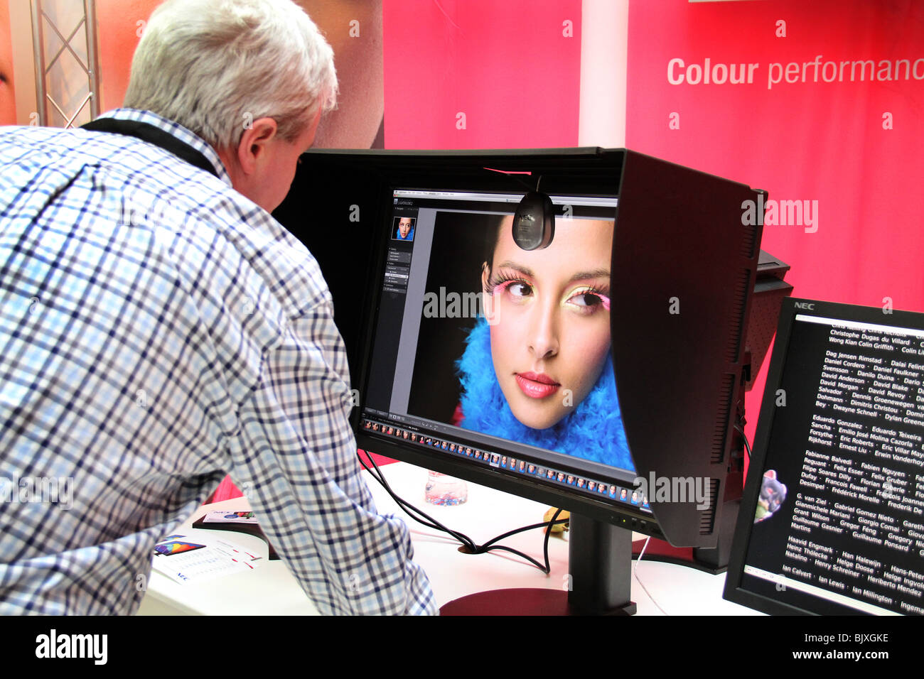 Testing Images People People at a photographic show testing and inspecting new equipment ...