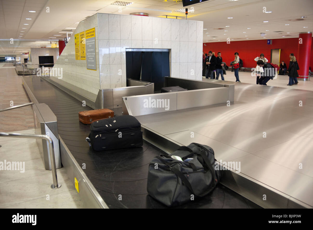 passengers waiting for luggage in Prague Ruzyně airport, Czech Republic