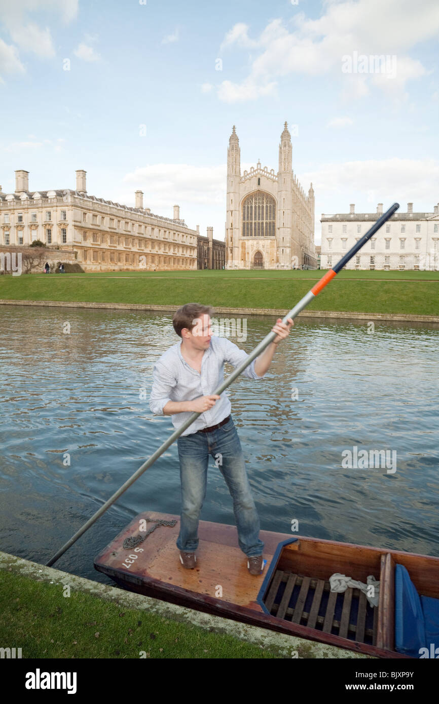 A university student punting on the River Cam by Kings College Chapel, Cambridge UK Stock Photo