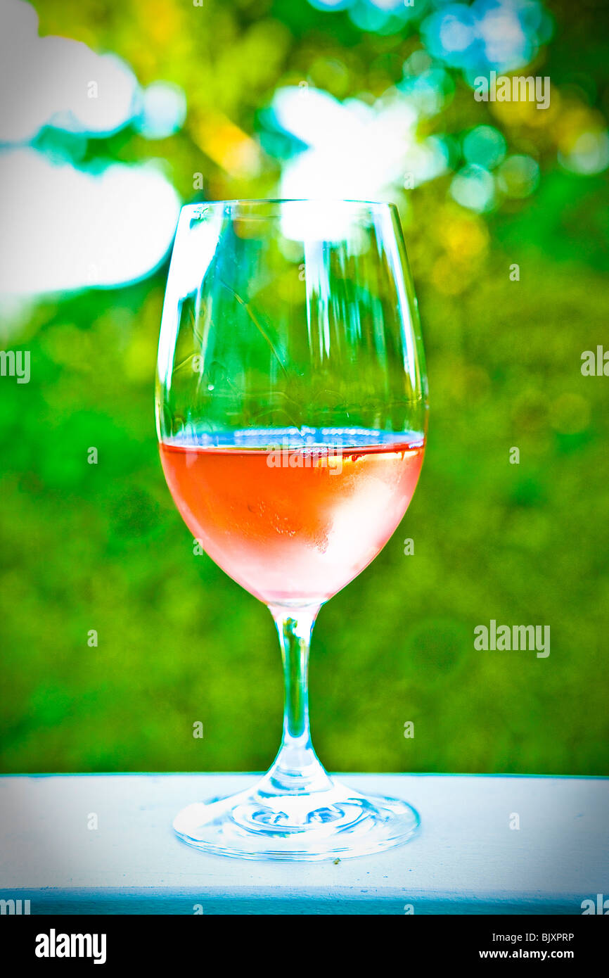 glass of white wine on outdoor table Stock Photo