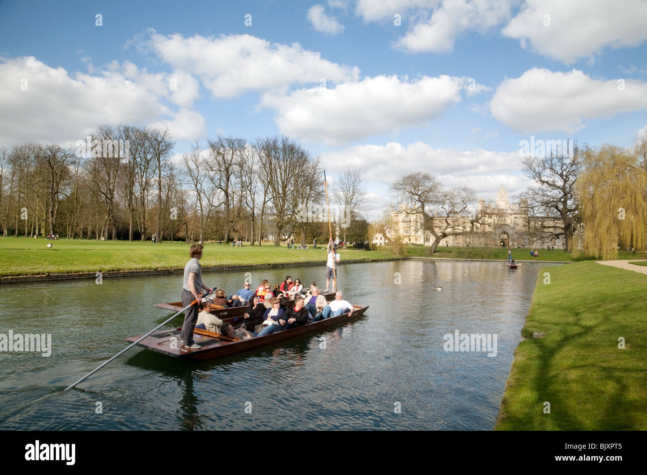 Punting on the River cam on the backs between Trinity and St Johns College in early spring, Cambridge UK Stock Photo