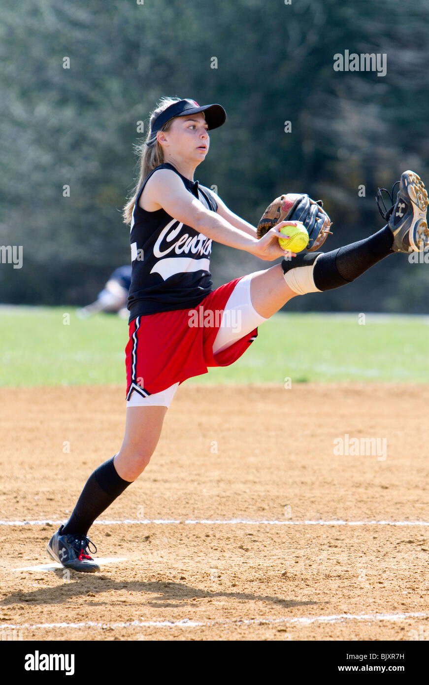 high kicking girls High kicking girls high school softball pitcher Stock Photo - Alamy