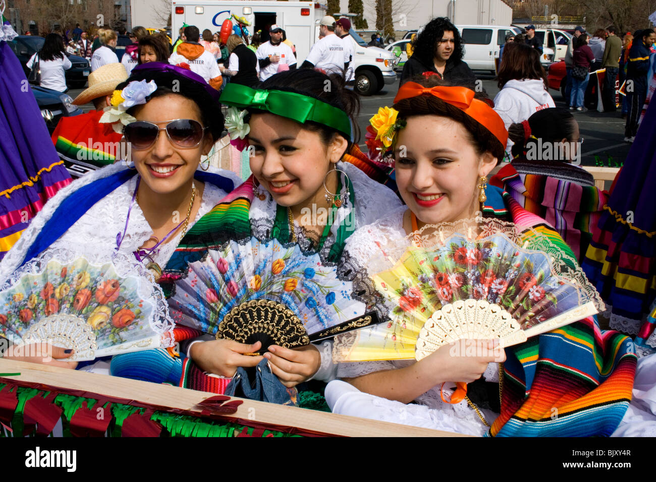 Hispanic teen girls dressed in traditional Mexican holiday attire 