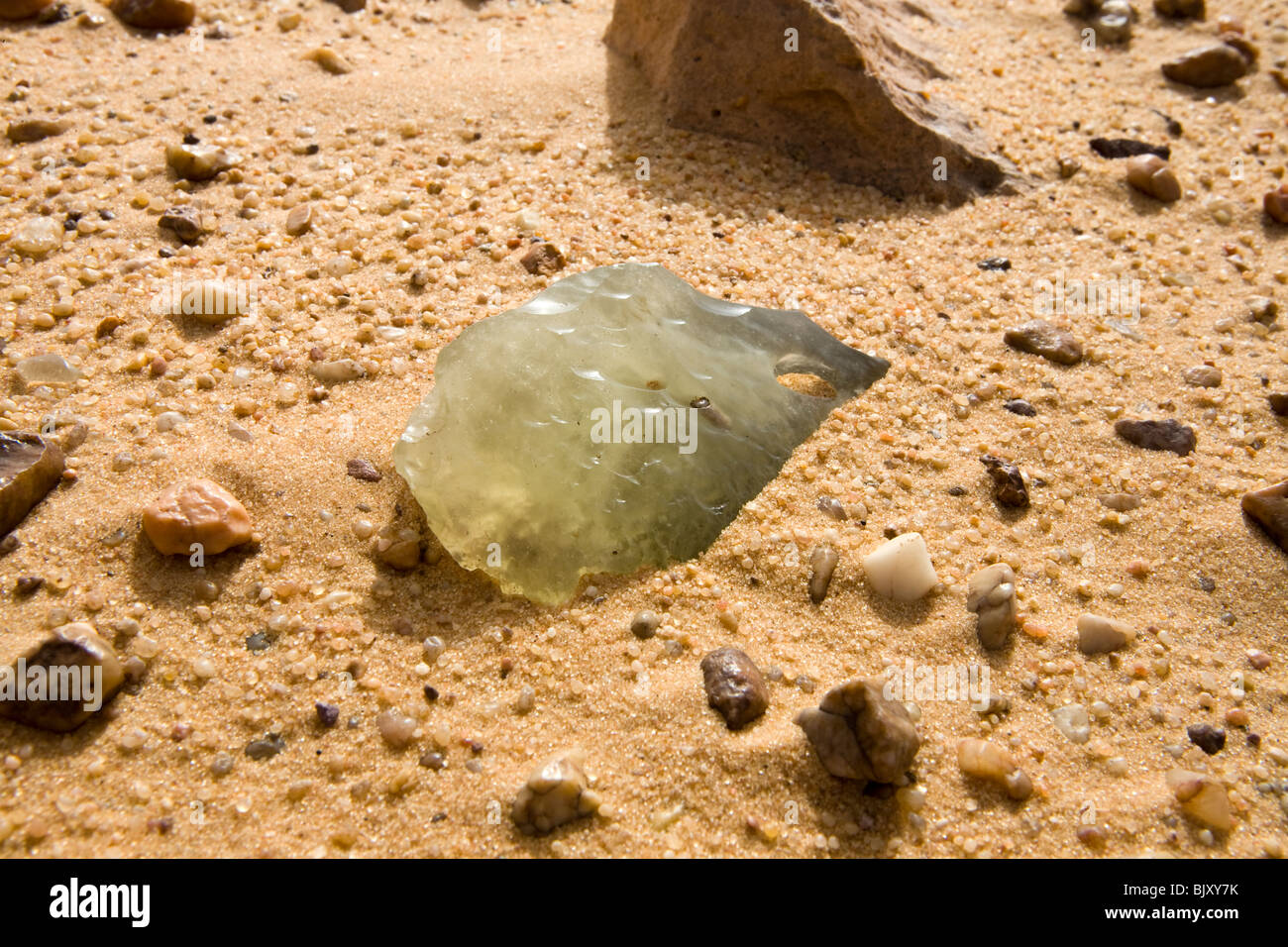 Silica glass fragments on the desert floor in an interdunal corridor of
