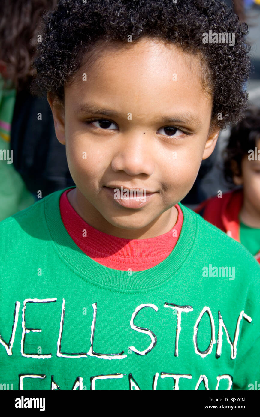 Latino boy age 4 wearing a green Paul Wellstone school sweatshirt. Cinco de Mayo Fiesta St Paul Minnesota USA Stock Photo