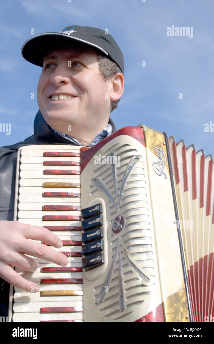 Happy Hispanic musician providing wonderful accordion festival music. Cinco de Mayo Fiesta St Paul Minnesota USA Stock Photo