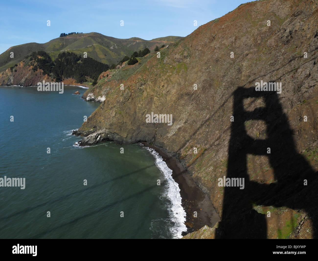 The shadow of the Golden Gate Bridge casted onto the Marin Headlands, Sausalito CA Stock Photo
