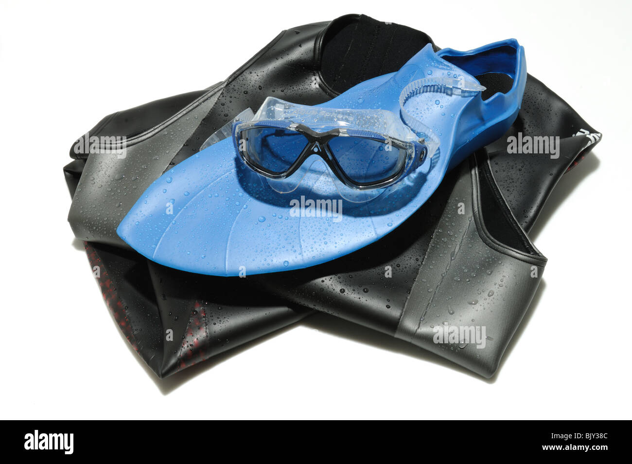 A swimming wet suit, flippers and goggles Stock Photo