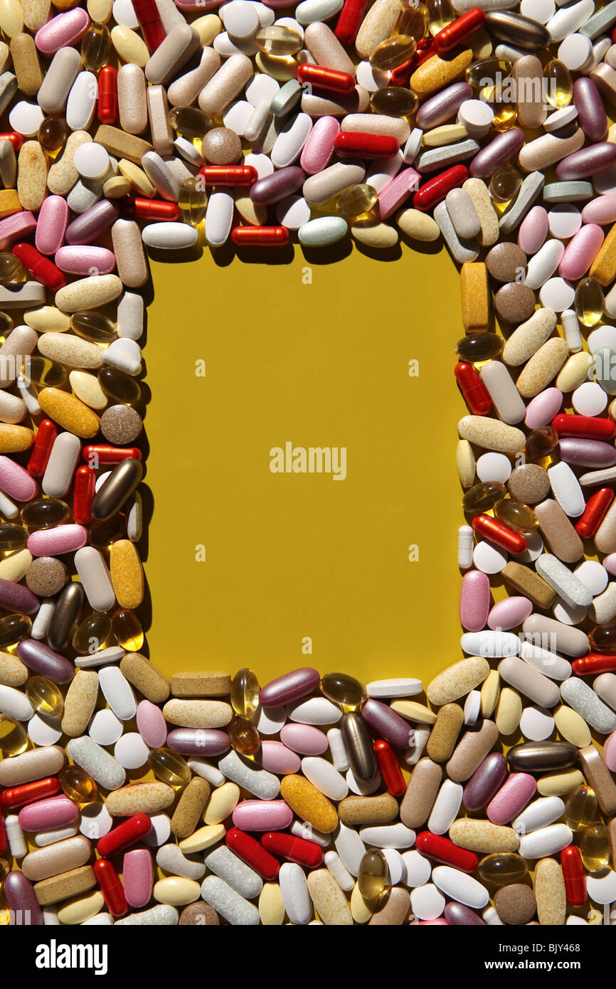 An blank rectangular space with a background of colorful capsules, tablets and pills Stock Photo