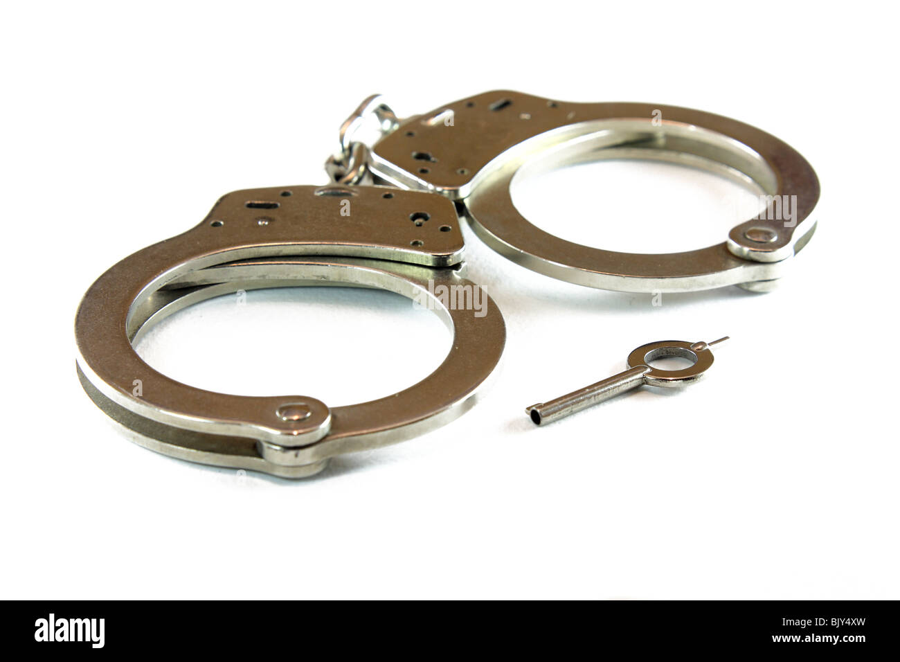 police handcuffs isolated on a white background cuff, prisoner Stock Photo