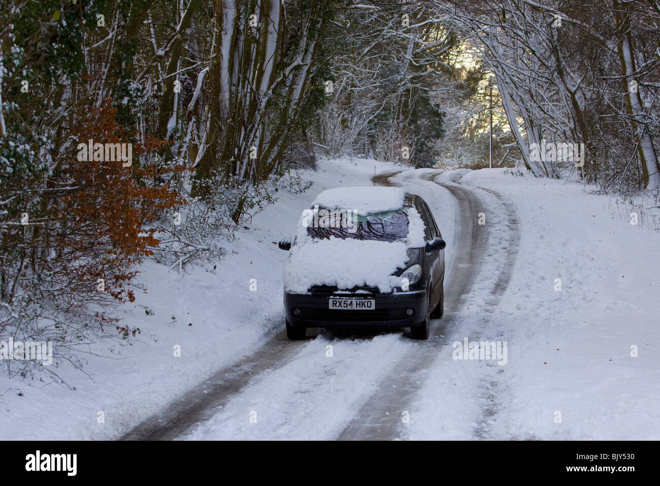 Snowy drive snow winter driving dangerous conditions Stock Photo