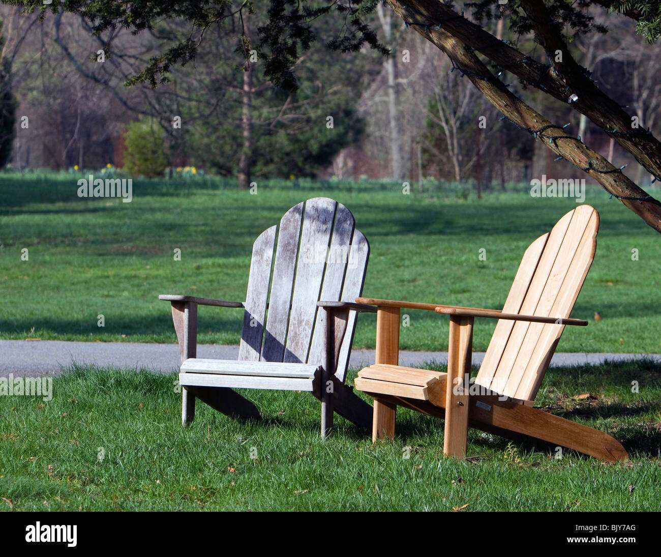 Two Adirondack chairs in a park like setting Stock Photo Alamy